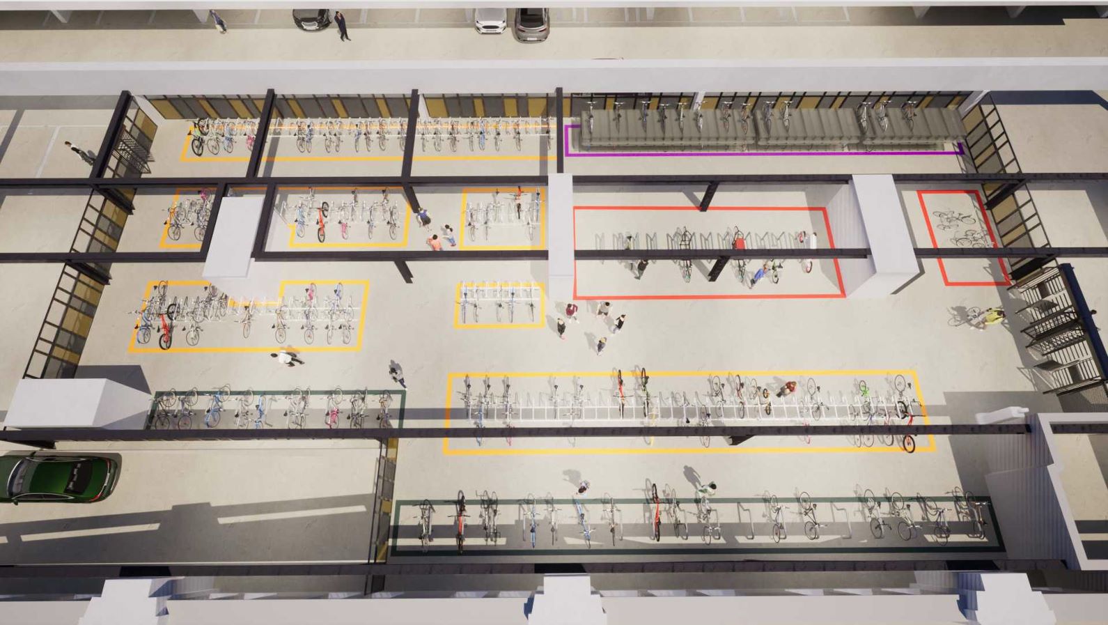 Luftaufnahme eines Fahrradabstellplatzes mit mehreren farblich markierten Bereichen und zahlreichen abgestellten Fahrrädern sowie einigen Personen